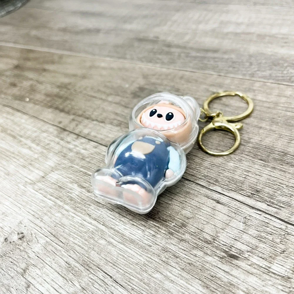 Labubu Monster Art Toy Keychain Blue Overalls Clear Protective Case Gold Tone